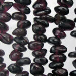 Strands of dark purple garnet chip beads