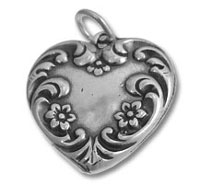 Ornate silver heart locket pendant with floral design