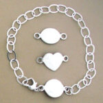 Silver bracelet with oval, heart, and round connectors