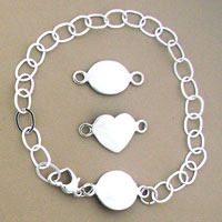 Silver bracelet with oval, heart, and round connectors