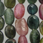 Close-up of multicolored oval gemstone beads