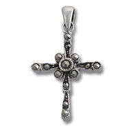 Ornate silver cross pendant with tiny beads