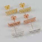 three pyramid stud earrings
