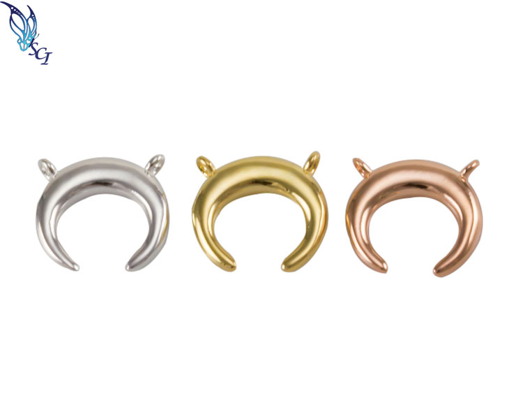 Silver, gold, and rose gold crescent pendants Silver, gold, and rose gold crescent pendants