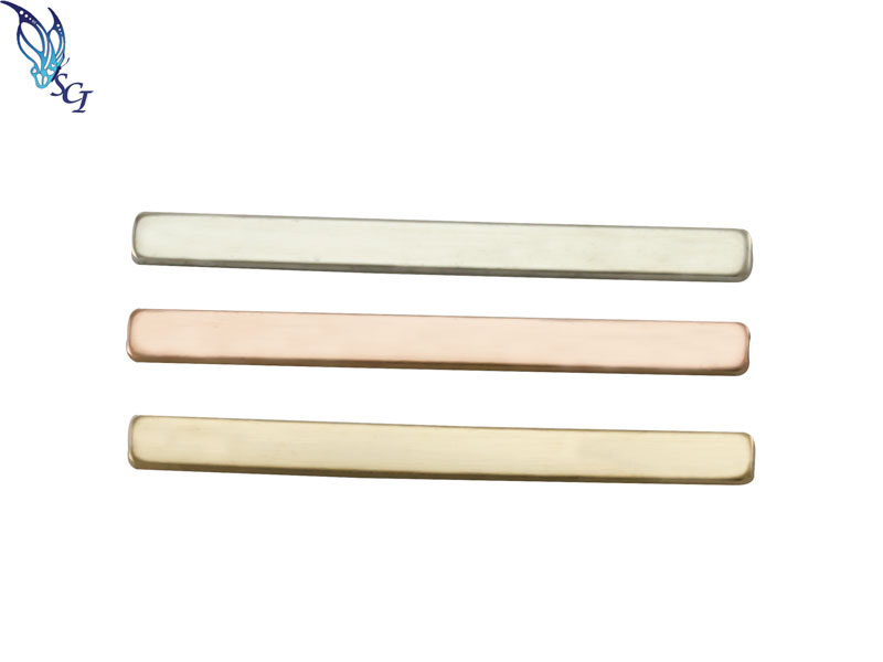 Three metallic rectangular bars in different finishes Three metallic rectangular bars in different finishes