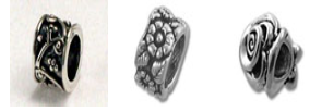 Three silver floral metal beads