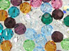Colorful round glass gems on white background